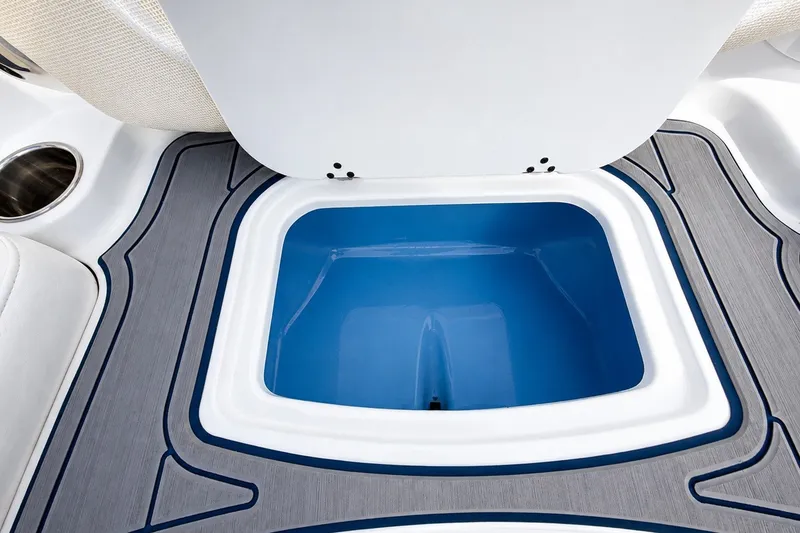 Slide: The Image of 2022 Tahoe 2150 boat storage compartment with blue interior and sleek design. - 20