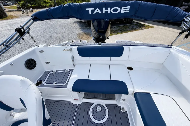 Slide: The Image of 2022 Tahoe 2150 boat interior with blue and white seating and flooring. - 32