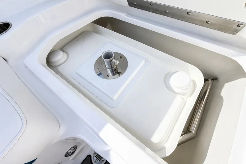 Slide: The Image of 2022 Tahoe 2150 boat storage compartment with integrated table mount. - 13