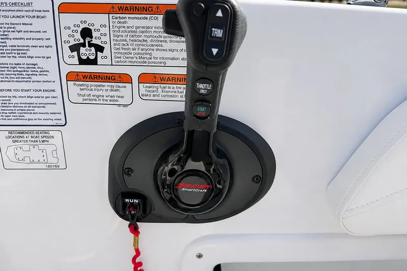 Slide: The Image of Throttle control panel on 2022 Tahoe 2150 boat with safety warnings and instructions. - 46