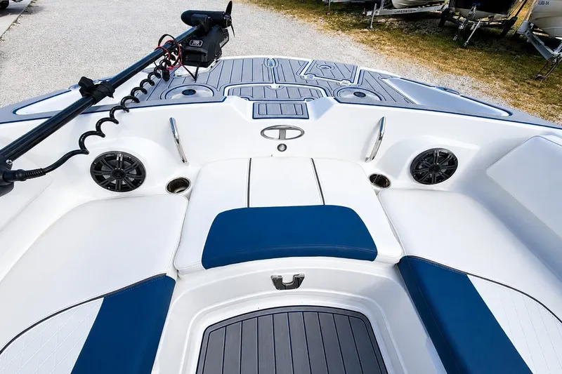 Slide: The Image of 2022 Tahoe 2150 boat interior with seating and speakers, featuring modern design elements. - 27