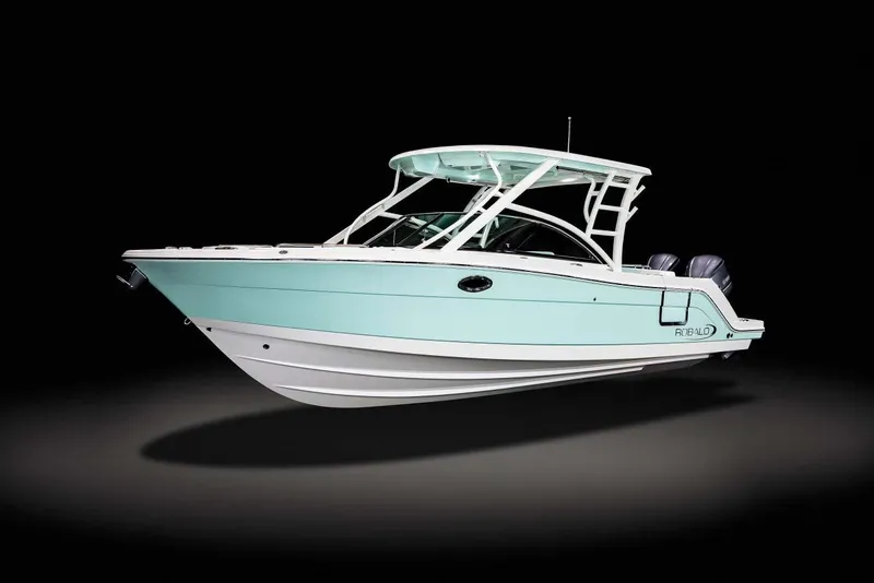 Slide: The Image of Manufacturer Provided Image: 2025 Robalo R317 Dual Console boat, sleek design, light blue hull, dual engines, side view. - 19
