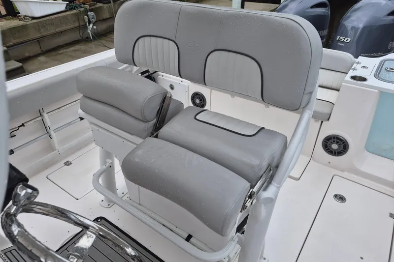 Slide: The Image of 2023 Sea Fox 268 Commander boat seating with dual Yamaha engines in the background. - 16