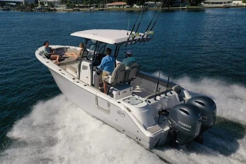 Slide: The Image of Manufacturer Provided Image: 2023 Sea Fox 268 Commander boat cruising on water with passengers. - 1