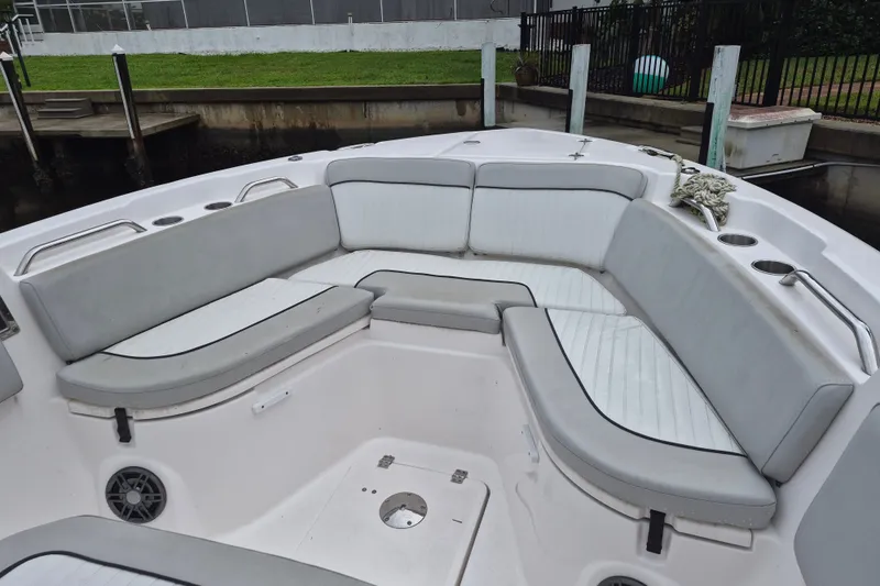 Slide: The Image of 2023 Sea Fox 268 Commander boat interior with cushioned seating and cup holders. - 11