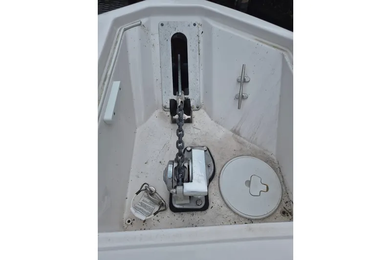 Slide: The Image of Anchor compartment of 2023 Sea Fox 268 Commander boat, featuring chain and winch. - 9