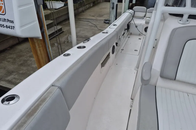 Slide: The Image of 2023 Sea Fox 268 Commander boat interior with seating and rod holders. - 18