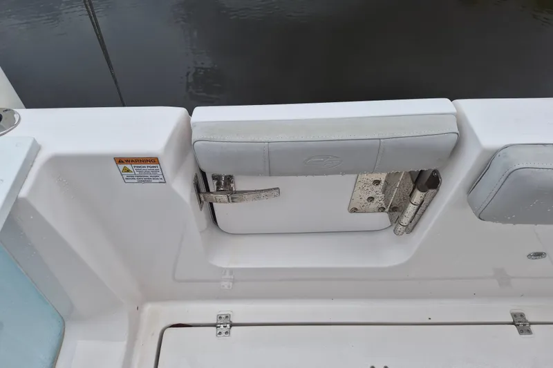 Slide: The Image of 2023 Sea Fox 268 Commander boat interior detail with seating and warning label. - 20