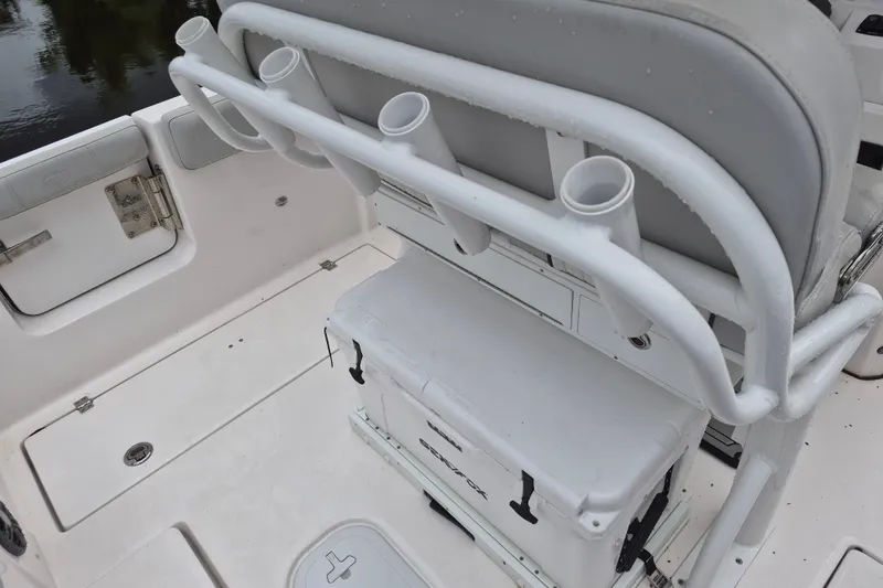 Slide: The Image of 2023 Sea Fox 268 Commander boat interior with rod holders and storage. - 25