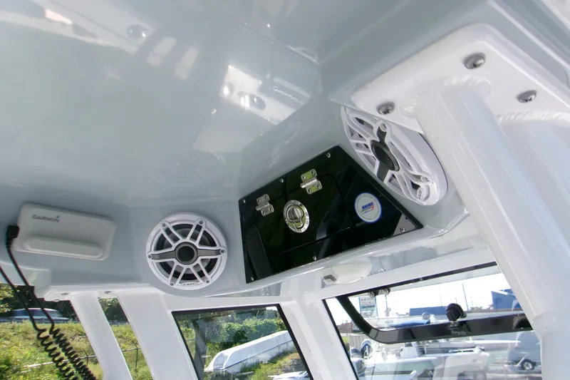 Slide: The Image of 2026 Sportsman Open 262 Center Console interior with speakers and Garmin device. - 18