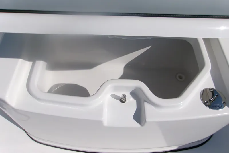 Slide: The Image of 2026 Sportsman Open 262 Center Console livewell with sleek white interior design. - 13