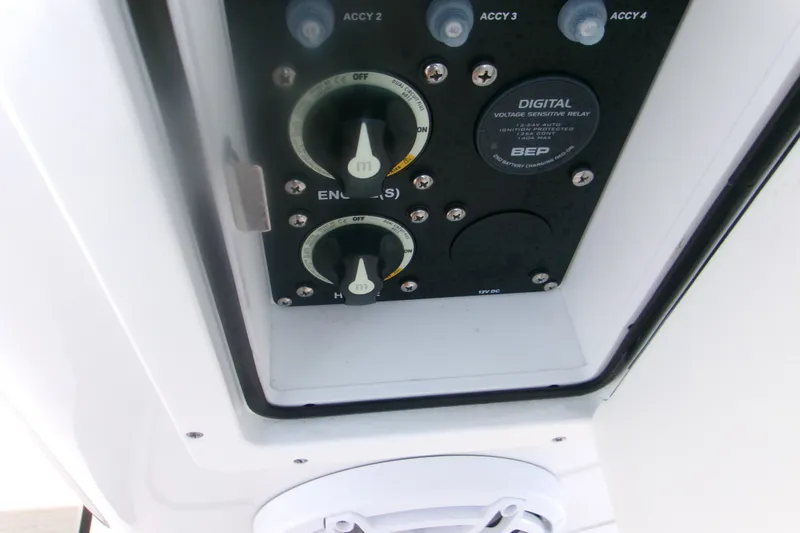 Slide: The Image of Control panel of 2026 Sportsman Open 262 Center Console boat, featuring digital voltage relay. - 17