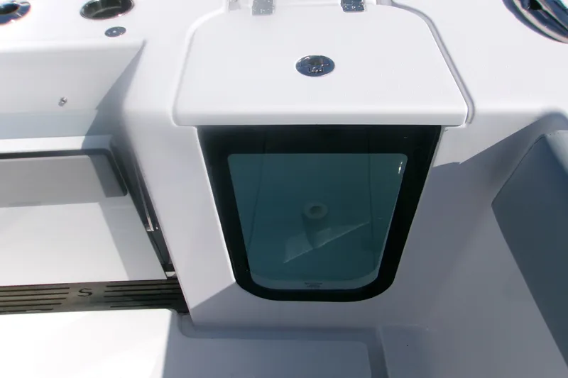 Slide: The Image of 2026 Sportsman Open 262 Center Console boat detail, featuring a storage compartment. - 8