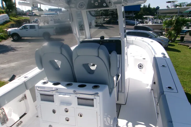 Slide: The Image of 2026 Sportsman Open 262 Center Console boat interior with dual seats and storage compartments. - 5