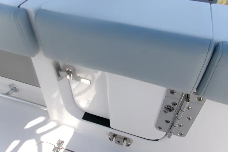 Slide: The Image of 2026 Sportsman Open 262 Center Console boat seat and hinge detail. - 6
