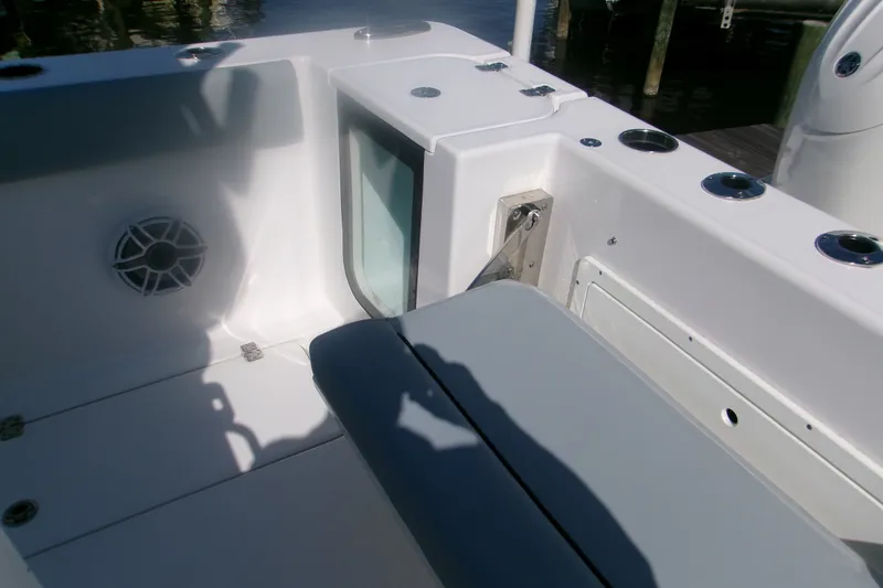 Slide: The Image of 2026 Sportsman Open 262 Center Console boat interior with seating and speaker. - 9