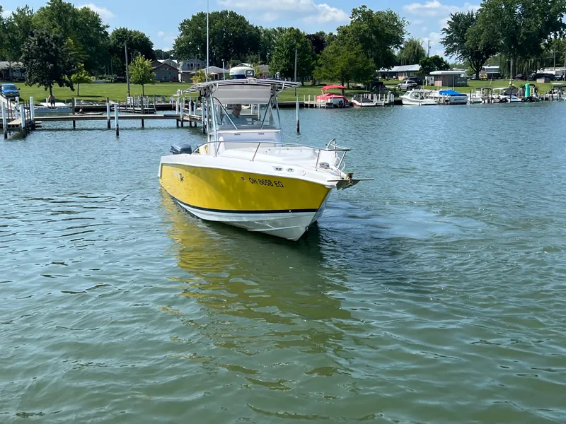 Slide: The Image of A yellow 2001 Donzi 352F boat cruising on a lake. - 1