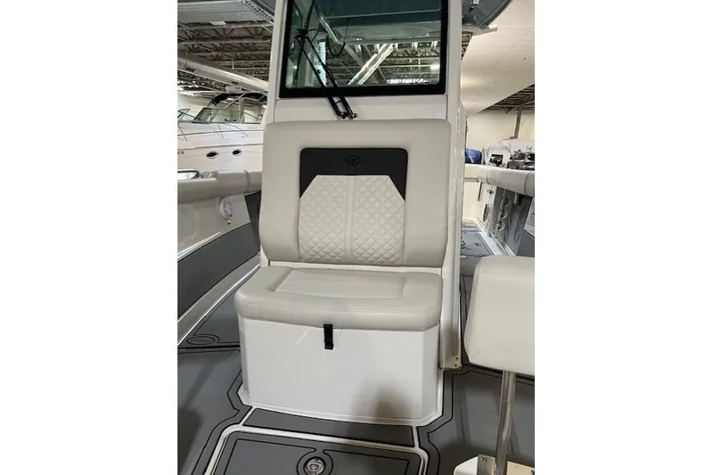 Slide: The Image of 2021 Sailfish 272 CC boat interior with cushioned seating and modern design. - 25