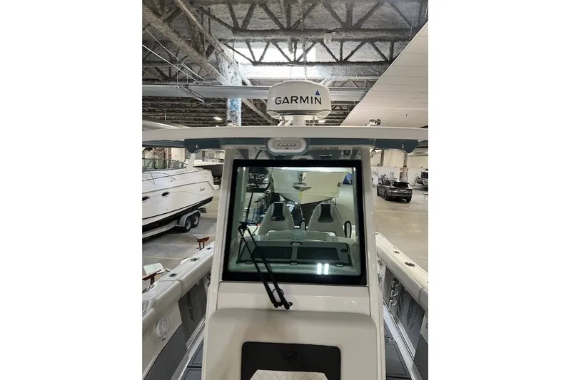 Slide: The Image of 2021 Sailfish 272 CC boat with Garmin equipment in a showroom. - 26