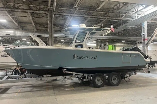 The Image of 2021 Sailfish 272 CC boat on trailer in indoor storage facility. - 14