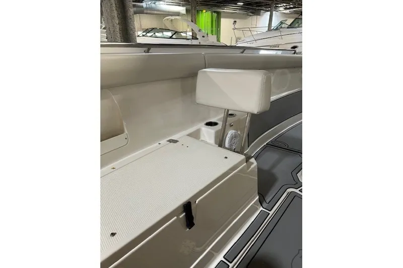 Slide: The Image of 2021 Sailfish 272 CC boat interior with seating and storage compartment. - 18