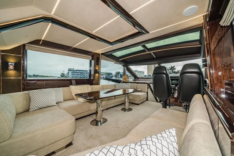 Slide: The Image of Luxurious interior of 2020 Galeon 680 Fly yacht with plush seating and panoramic windows. - 13
