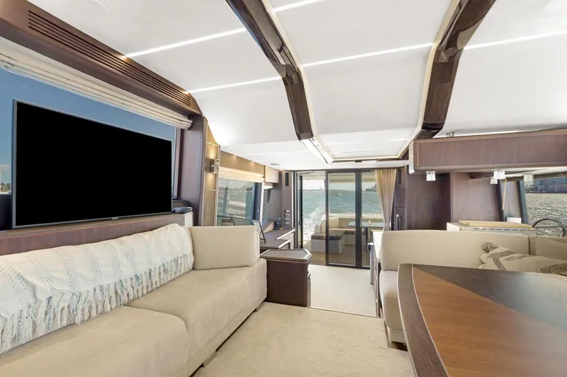Slide: The Image of Luxurious interior of 2020 Galeon 680 Fly yacht with elegant seating and large windows. - 15