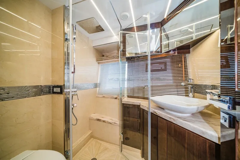 Slide: The Image of Luxurious bathroom interior on 2020 Galeon 680 Fly yacht, featuring modern fixtures and elegant design. - 22