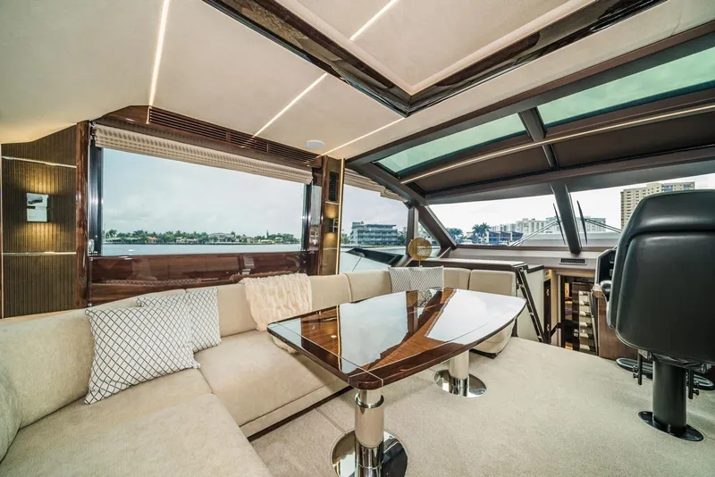 Slide: The Image of Luxurious interior of 2020 Galeon 680 Fly yacht with elegant seating and panoramic windows. - 19