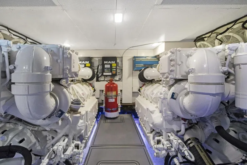 Slide: The Image of Engine room of 2020 Galeon 680 Fly yacht with dual MAN engines and fire extinguisher. - 32