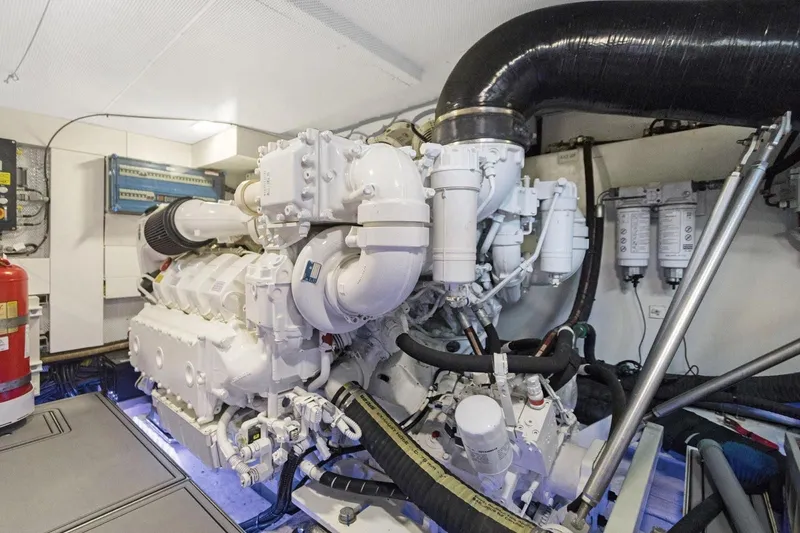 Slide: The Image of Engine room of 2020 Galeon 680 Fly yacht, showcasing complex machinery and piping. - 33