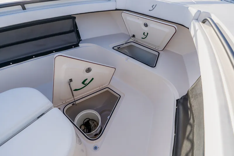 Slide: The Image of Interior view of 2023 Young 34 boat with open storage compartments. - 18