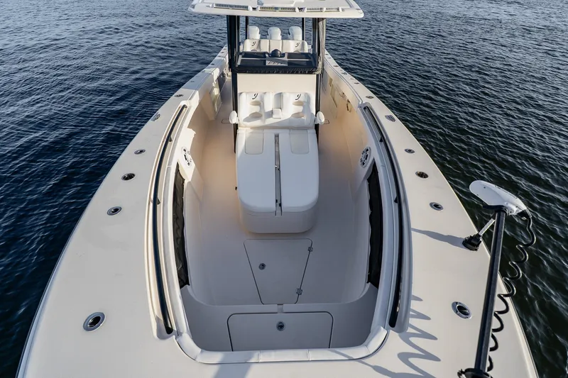 Slide: The Image of 2023 Young 34 boat on water, showcasing spacious deck and seating area. - 20