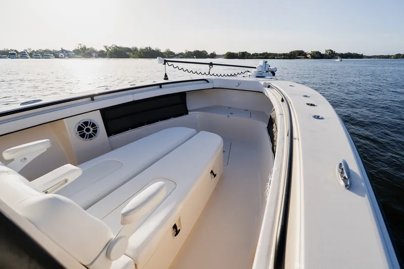 Slide: The Image of Luxury 2023 Young 34 boat interior with white seating on calm water. - 14