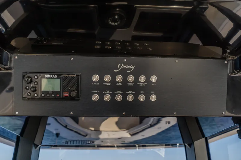 Slide: The Image of Control panel of a 2023 Young 34 boat with Simrad navigation system. - 34