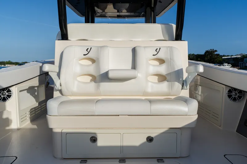 Slide: The Image of Luxury seating on a 2023 Young 34 boat, featuring white cushioned seats and armrests. - 36