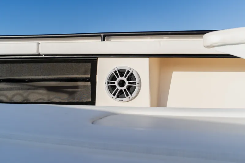 Slide: The Image of Boat speaker on Young 34 model, 2023, against clear blue sky. - 19