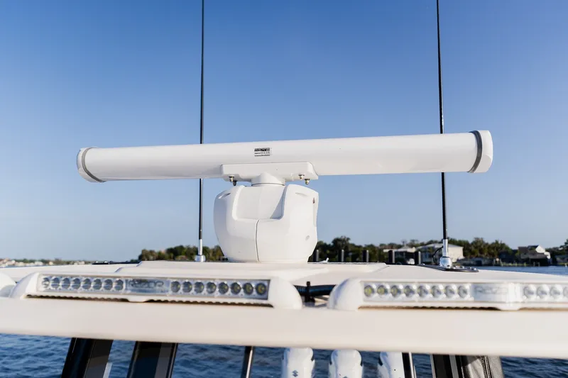 Slide: The Image of Radar system on a 2023 Young 34 boat, clear blue sky background. - 25