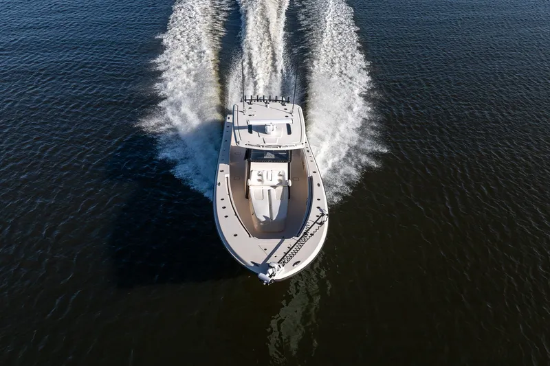 Slide: The Image of Aerial view of 2023 Young 34 boat cruising on open water. - 8
