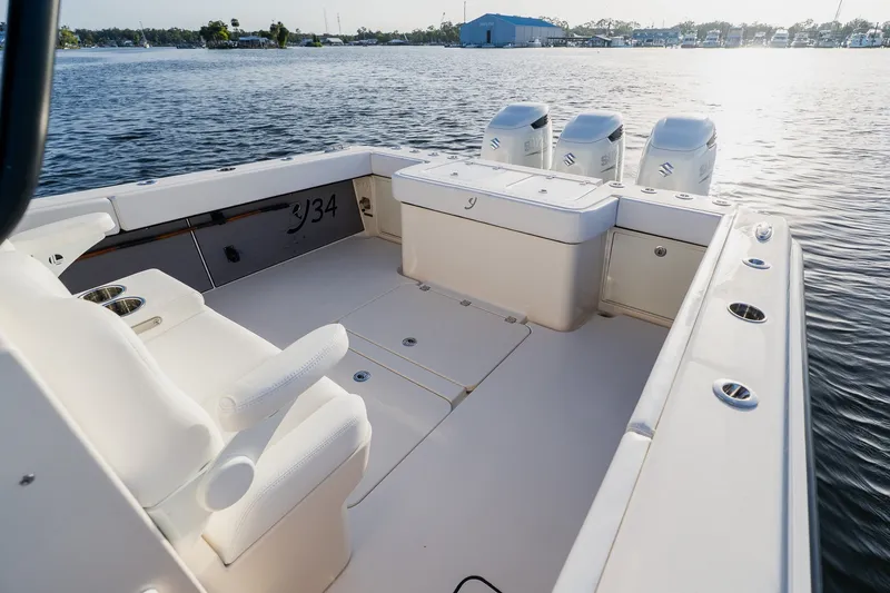 Slide: The Image of Luxury Young 34 boat deck with seating, 2023 model, on calm water. - 42