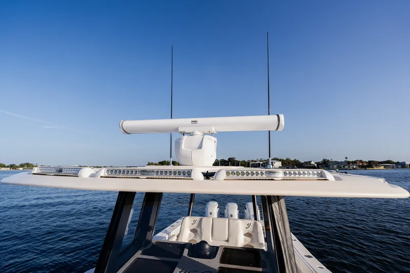 Slide: The Image of Young 34 boat with radar and antennas on calm water, 2023 model. - 24