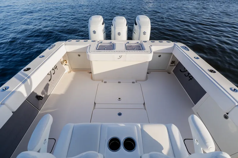 Slide: The Image of Luxury Young 34 boat deck with triple engines, 2023 model, on calm water. - 43