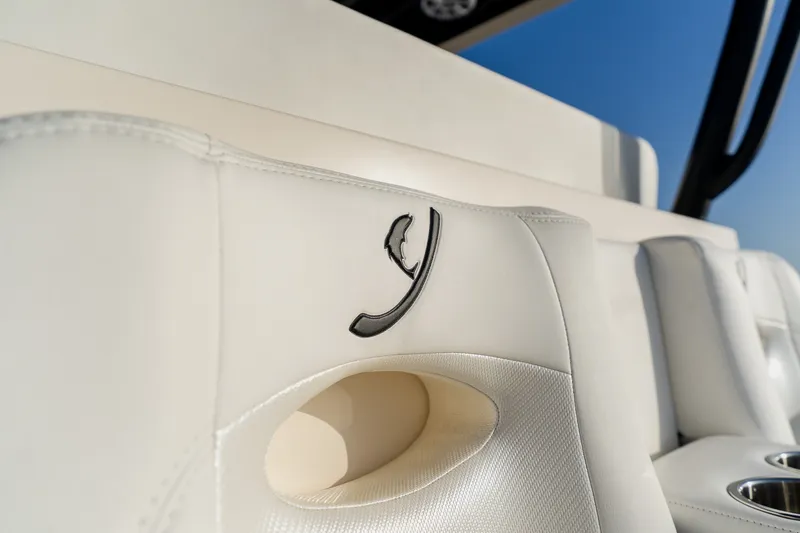 Slide: The Image of Luxury white leather seating on 2023 Young 34 boat, featuring elegant stitching and logo. - 41