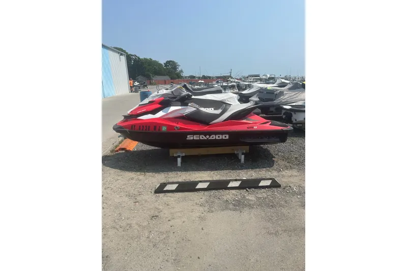 Slide: The Image of 2012 Sea-Doo GTI SE jet ski parked outdoors on gravel lot. - 7