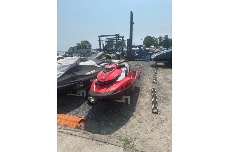 Slide: The Image of 2012 Sea-Doo GTI SE jet ski in a storage area, sunny day. - 5