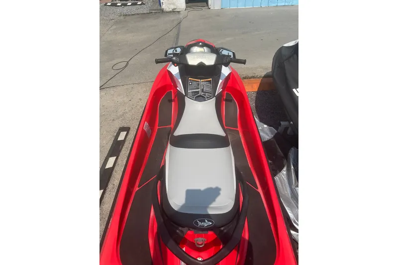 Slide: The Image of Red 2012 Sea-Doo GTI SE jet ski parked on concrete surface. - 4
