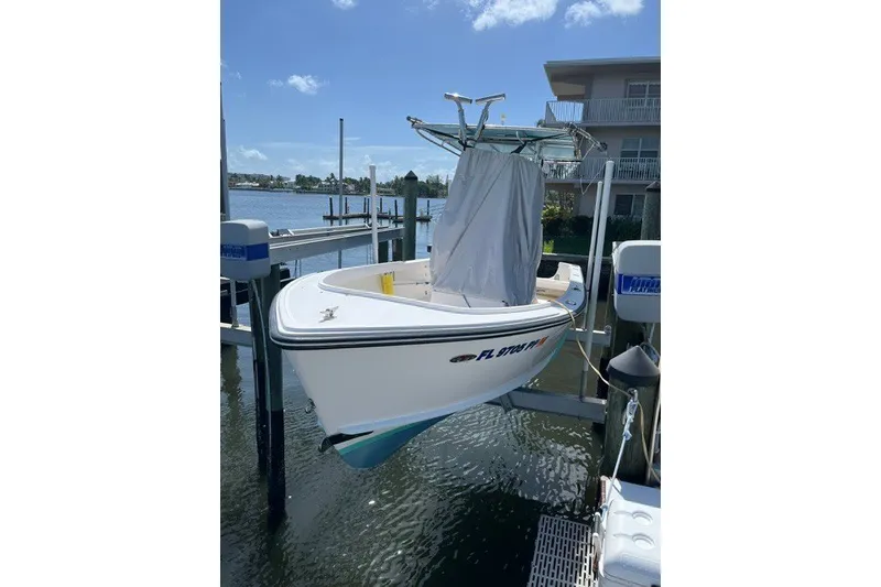 Slide: The Image of 2014 Albury Brothers 20 boat on lift by waterfront property. - 14