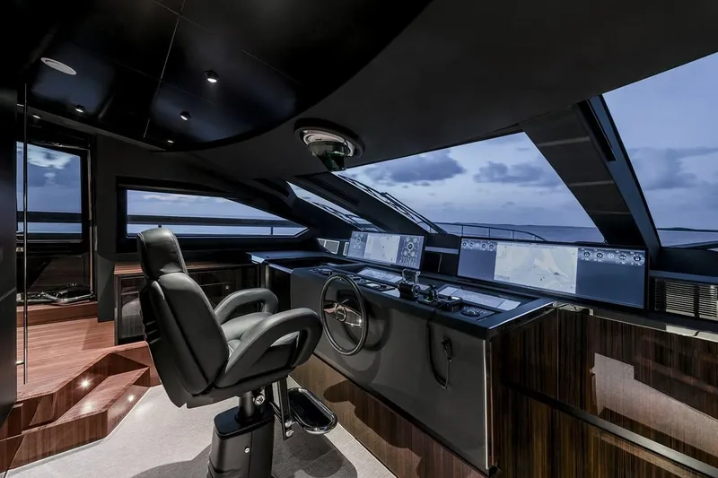 Slide: The Image of Luxurious helm of 2023 Riva 130' Bellissima yacht with modern navigation displays. - 30