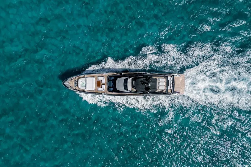 Slide: The Image of Aerial view of 2023 Riva 130' Bellissima yacht cruising in clear blue waters. - 5