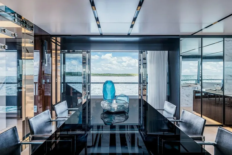 Slide: The Image of Luxurious interior of 2023 Riva 130' Bellissima yacht with ocean view and elegant dining area. - 33